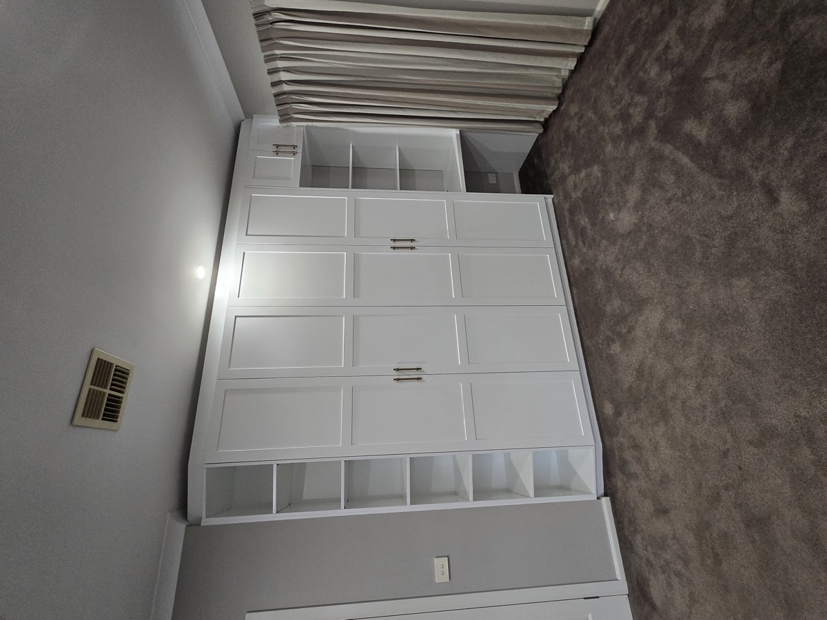 White built-in wardrobe with shaker doors