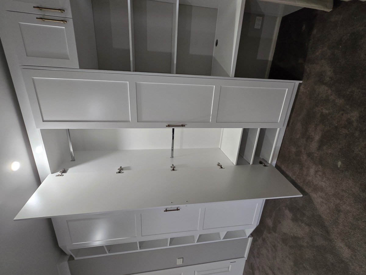 White built-in wardrobe with fold-down desk