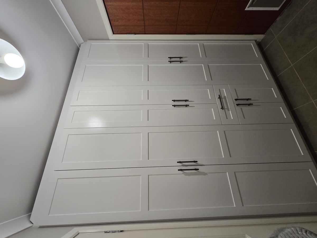 White wardrobe with integrated ironing board