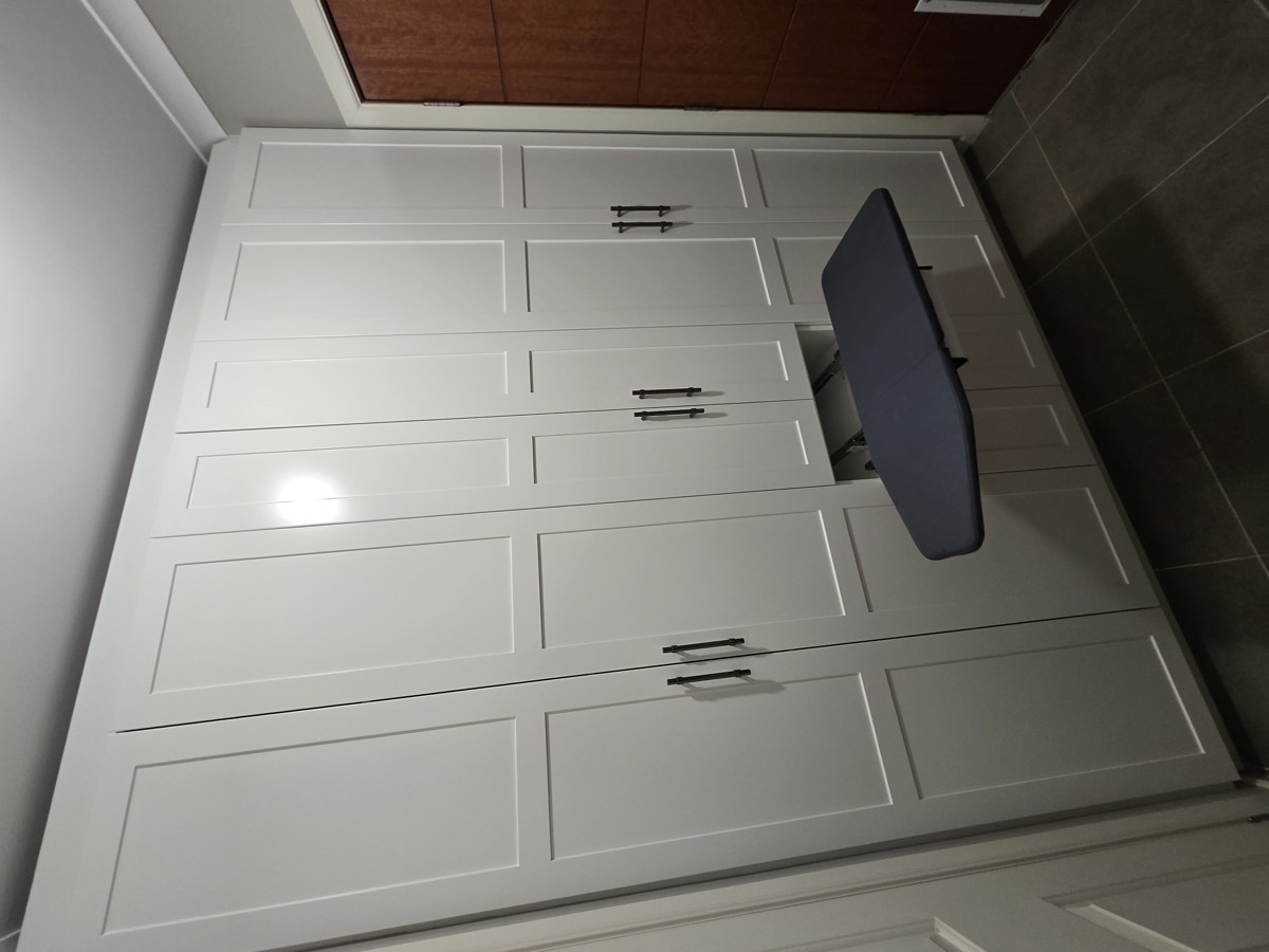 White wardrobe ironing board open