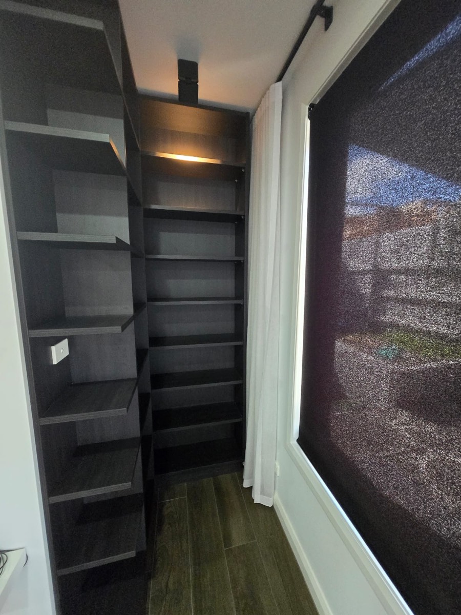 Custom dark shelving unit with lighting